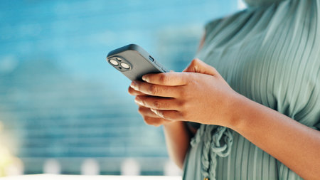 City, phone and hands of business woman for networking, social media and website for contact. Professional, corporate and person on smartphone for text message, email and online in town for travel.の写真素材