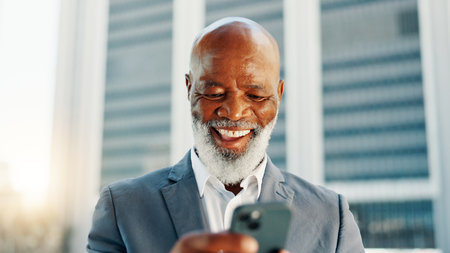 Business, smartphone and black man in city, scroll and urban town with social media, network and communication. Mature person, accountant and financial advisor with tech, texting or smile in New Yorkの写真素材