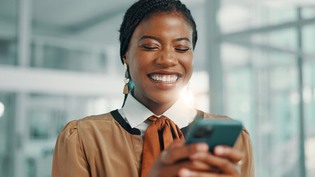 Business, smile and black woman in office, cellphone and social media with style editor. African person, magazine writer and employee in workplace, smartphone and email with review, internet or funnyの写真素材