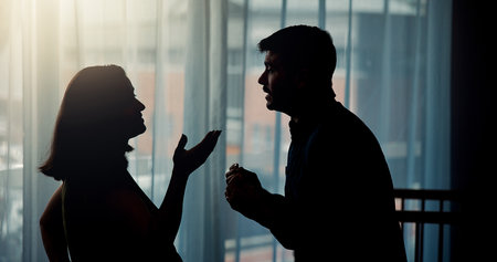 Conflict, couple and disagreement with argument in home for cheating affair, marriage infidelity or betrayal. Silhouette, frustrated people and pregnant woman for toxic relationship, drama or divorceの写真素材