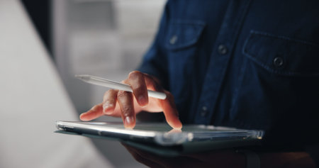 Tablet, pen and hand of man in studio for animation illustration with creative project. Digital technology, sketching and male concept artist drawing for character design with virtual art website.の写真素材