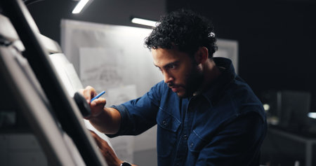 Night, designer or man with project for drawing, sketching or editing with artistic skills in office...