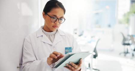 Researcher, science and woman in lab, tablet and scroll with results for experiment. Person,...