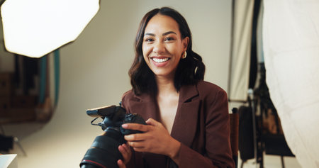Happy, woman and photographer with portrait in studio for photoshoot bts, catalog and selection. Smile, female person and camera for photography career, film production and about us in media industryの写真素材