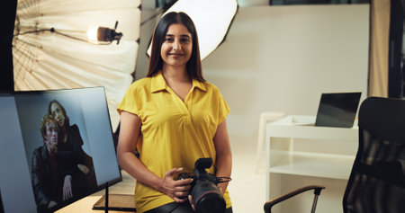 Portrait, photographer and woman with camera, smile and confident of about us for project or picture. Post production, screen and person with tech for magazine, artist and happy with image on setの写真素材