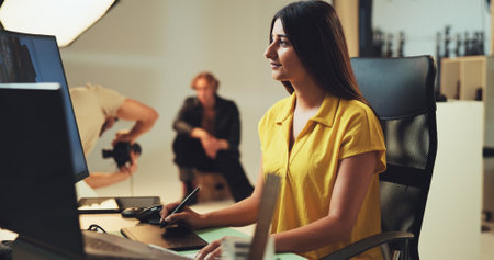 Retouching, woman and photography editor on computer with post production software on graphic tablet. Studio, design or creative art on laptop for fashion magazine, drawing or editing media backstageの写真素材