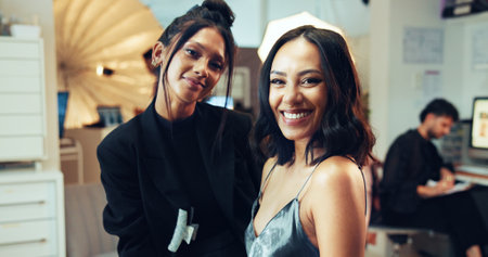 Photography, portrait and smile of model with makeup artist in studio for behind the scenes preparation. Getting ready, happy and styling with woman on set for catalog or magazine photoshootの写真素材