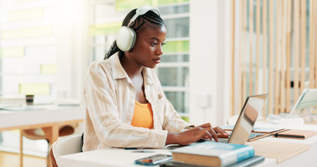 Education, student and woman with laptop, headphones and exam in classroom with info, online and...