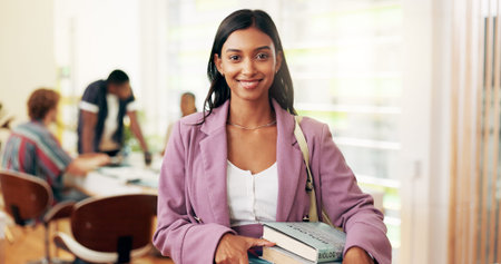 University student, girl and portrait with smile, books and bag for back to school, learning or...
