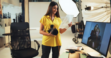 Choice, photographer and woman with pictures, camera and post production in studio with documents....