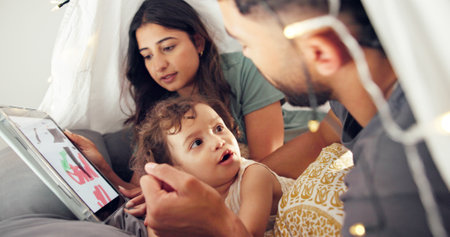 Tent, parents and tablet with baby in home for bonding together, painting app and connection with trust. Tech screen, people and fun activity with kid in blanket fort for relationship, love or careの写真素材