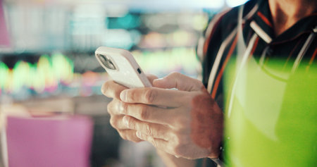 Business, hands and man in office, smartphone and message to contact, social media and email. Closeup, employee and person in workplace, cellphone and digital app with communication and textingの写真素材