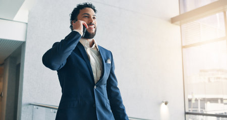 Phone call, smile and man in office, talking and communication with contact for insurance or business. Happy, broker and person with mobile for conversation, corporate or explaining policy of companyの写真素材