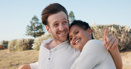 Hug, love and smile with couple in nature for travel vacation, bonding and romantic date. Happiness, summer holiday and marriage anniversary with man and woman outdoor for relax, adventure and cuddleの写真素材