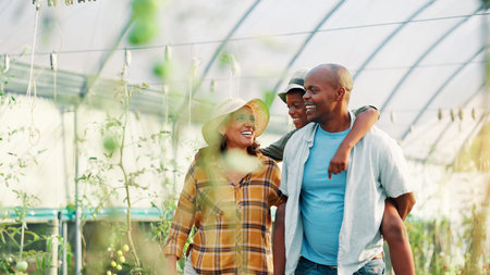 Family, child and bonding in farm, walking and parents with son in greenhouse, growth and produce....