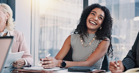 Conversation, happy and businesswoman in meeting for laughing together, joke or planning. Corporate, collaboration and funny humor with employee friends talking in workplace for bonding or teamworkの写真素材