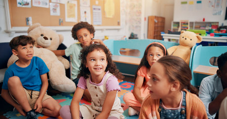 School, class and kids on floor with teacher for reading lesson, education and learning. Montessori, students and happy children with educator for storytelling, language development and knowledgeの写真素材