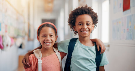 Education, hug and portrait with friends in school together for bonding, child development or future. Learning, smile and students with kids embracing in hallway of academy for scholarship or studyの写真素材