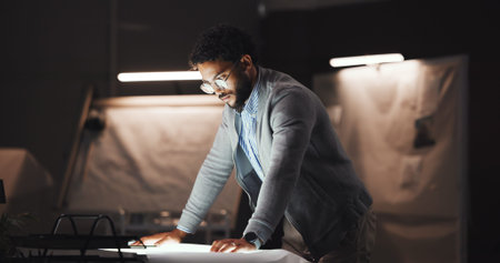 Businessman, architect and reading with blueprint for construction planning or building design. Man,...
