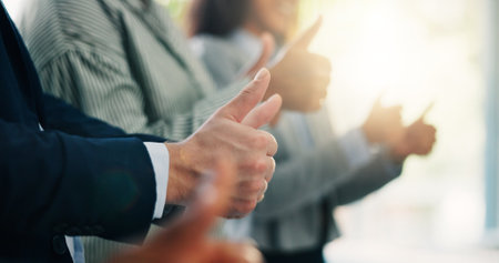 Thumbs up, hands and business people in office with agreement, ok or satisfaction for goal. Collaboration, success and team of financial managers with approval emoji for target achievement together.の写真素材