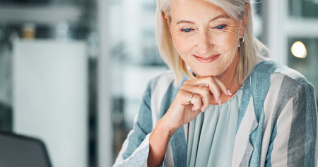 Business, thinking and mature woman with smile, entrepreneur and planning for company growth or web. Corporate, contemplating and person with laptop, opportunity and ideas for investment in officeの写真素材