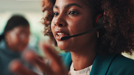 Call center, headset and problem solving with black woman in office for assistance, consulting or help. Contact us, customer service and support with virtual assistant at work for sales feedbackの写真素材