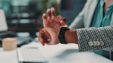 Checking, time and person with watch, office and overtime for employee with deadline, night and hands. Business, workaholic and accountant with tech for schedule, planning or working late for projectの写真素材