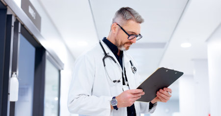 Doctor, healthcare or man with clipboard at clinic for patient health chart, medical information or...