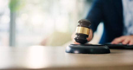 Hands, man and judge with hammer in courtroom for attention, maintain order and authority decision....