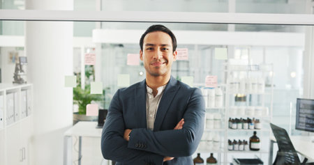 Portrait, research and man in lab, arms crossed and funding for chemistry experiment. Face, happy person and employee in workplace, drug trail and testing for cure, vaccine development and confidenceの写真素材