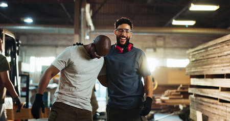 Carpenter, team and men with smile, workshop and friends with glasses for safety, laughing and hug. Happy, artisan and people with eyewear in business, woodworking and contractor for furnitureの写真素材