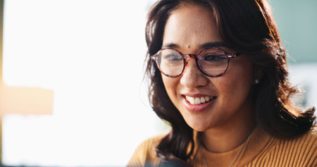 Creative, glasses and smile of designer woman in office for planning, report or research. Computer,...