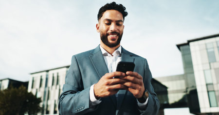 City, businessman and typing with phone for trading, online investment or happy with communication....