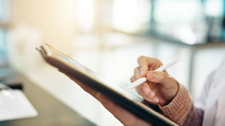 Person, hands and writing with tablet for research, study or online development at office. Japan,...