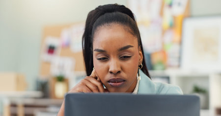 Business, thinking and black woman in office, laptop and confused with publishing industry. African...