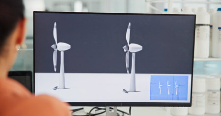 Screen, engineer and person with monitor, office and plan for windmill design, back or renewable...