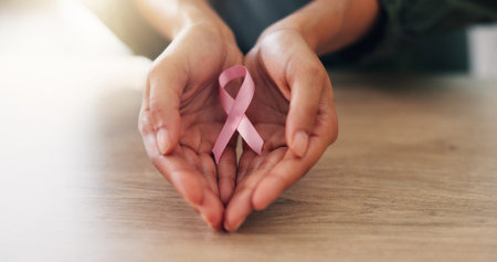 Pink ribbon, hands and woman for breast cancer awareness, hope and healthcare support. Kindness,...