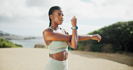 African, runner or woman stretching on road for running exercise, thinking and fitness training. Ideas, muscle warm up or female athlete on street with wellness, mobility workout or outdoor sportsの写真素材
