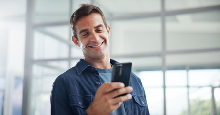 Smile, office and business man with smartphone for networking, typing and social media marketer...