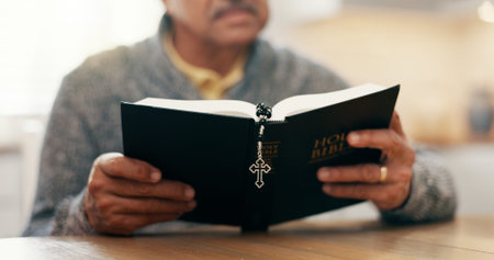 Reading, religion and bible with hands of person for worship, spiritual study or Christian prayer....