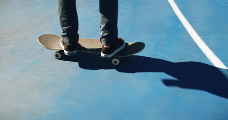 Skateboard, shoes and person outdoor for fitness, competition challenge or sport. Skate park, legs and riding for action with performance, practice balance or hobby for exercise on court for trainingの写真素材