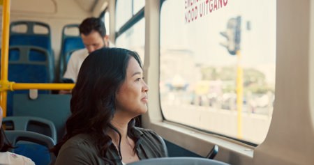 Travel, woman and happy with window view on bus for journey, sightseeing adventure and morning commute. Passenger, person and smile on public transport for trip destination, tourist location and rideの写真素材