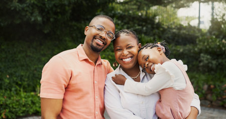 Outdoor, black family and girl with hug in portrait, carrying and bonding together with smile. Father, mother and child in nature for holiday, weekend fun and love with connection for happinessの写真素材