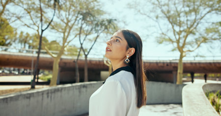 Business, travel and woman in city, thinking and daydreaming with break, wonder and writer. Person, employee and magazine editor in street, appointment and decision with choice, ideas and commuteの写真素材