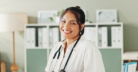 Portrait, doctor or woman with smile, healthcare or confidence for wellness in clinic. Happy, professional help and person in hospital for career, pharmaceutical medicine or medical service in Mexicoの写真素材