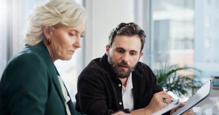 Client, meeting and paperwork with business people in office for negotiation, feedback and planning. Advisor, consulting and proposal with employee in agency for contract policy, review and projectの写真素材