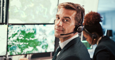 Man, meteorology and monitor for weather, forecast or voip headset at contact center, system and map for atmosphere. Person, scientist and pc screen for temperature, clouds and hurricane in portraitの写真素材