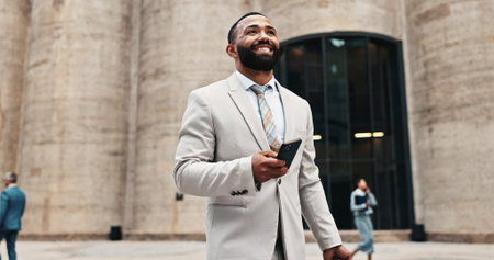 Business man, phone and thinking in city outdoor with opportunity, internet or connection. Happy entrepreneur with idea for social media networking, future mobile app or contact for deal proposalの写真素材