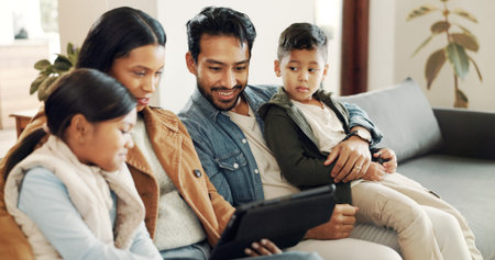 Sofa, father and mother with children for tablet, streaming movies and bonding together as family....