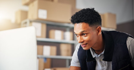 Boxes, logistics and man in warehouse, computer and online order with shipping, export and...